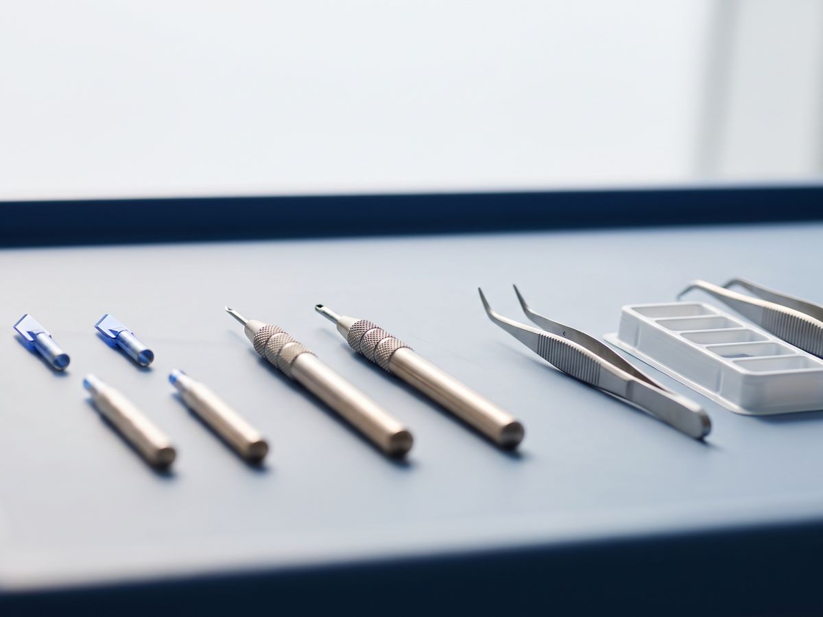 Sapphire blade and micro-punch instruments on a sterile tray