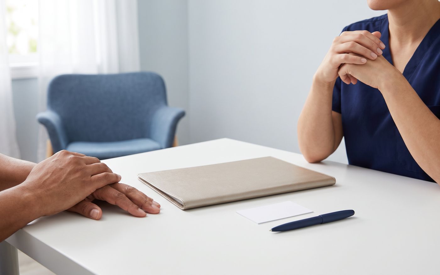 Patient hands near folder and pen during Afro-textured hair transplant payment consultation