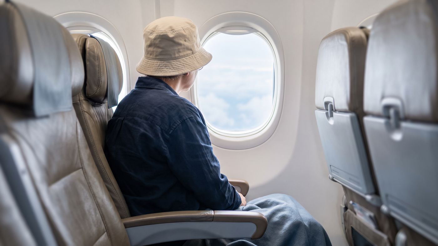 A short domestic flight is usually fine after the next-day wash — follow your surgeon's advice.